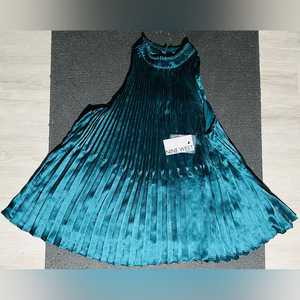 Nine West high fashion neck Small size edgy lightweight blouse, new with tag.